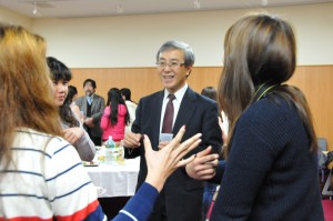 President Sato has a warming conversation with students