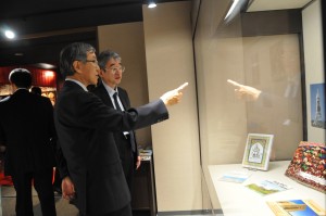 The President Sato and Kato General Affairs of Executive Director enjoy to look at the exhibits